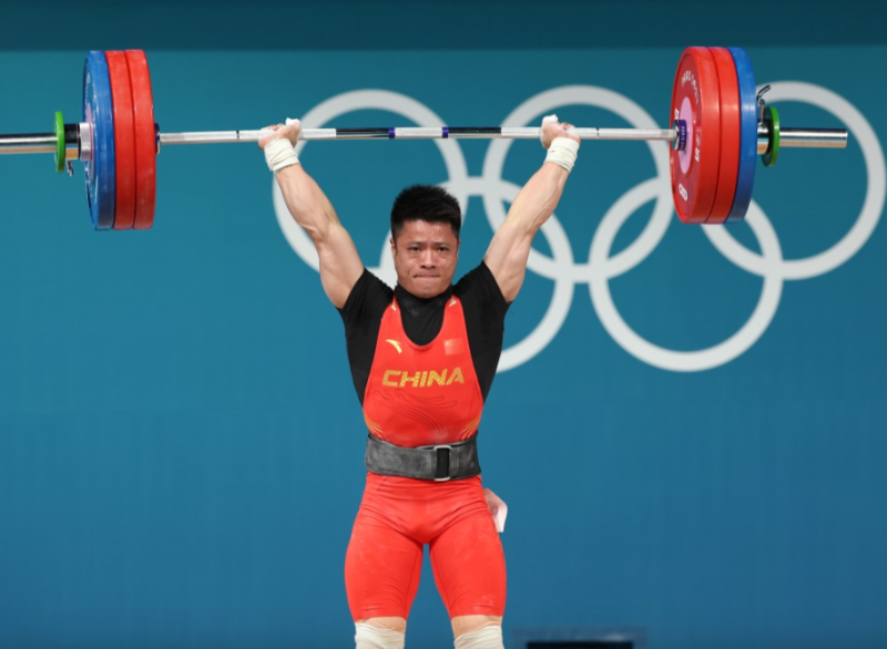 李發彬衛冕舉重男子61公斤級賽事。新華社