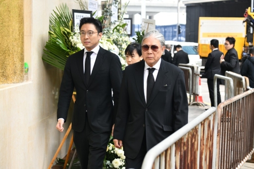 港協暨奧委會會長霍震霆及其兒子霍啟山。